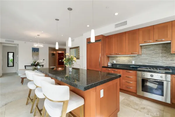 a dining room with furniture a window and kitchen view