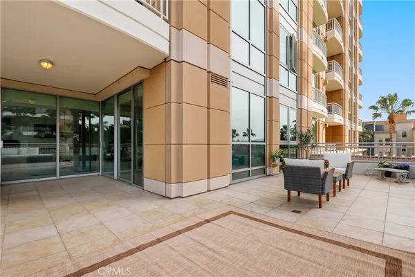 a view of a chairs and table in a patio