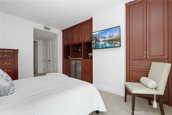 a bedroom with a bed and furniture