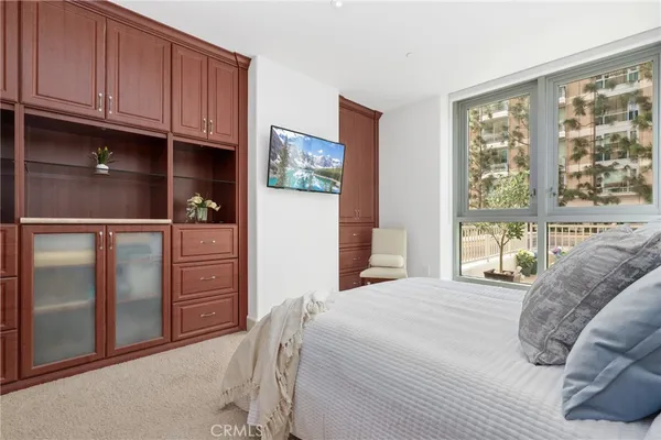 a bedroom with a bed window and closet
