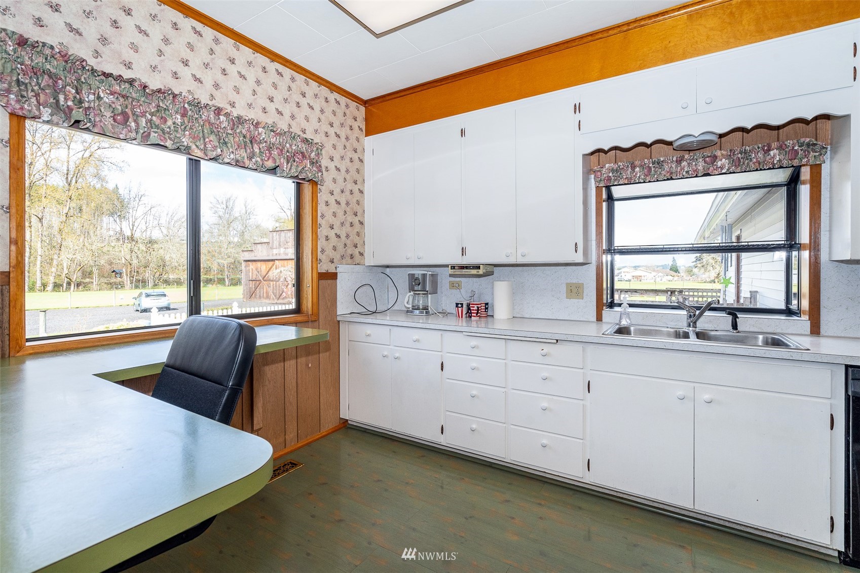 172 Bunker Creek Road Chehalis, WA 98532 - Photo 5 of 40 a kitchen with granite countertop white cabinets and a large window