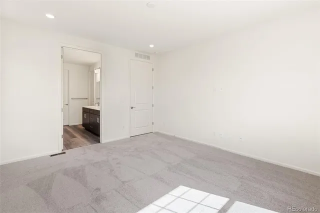 an empty room with a fireplace