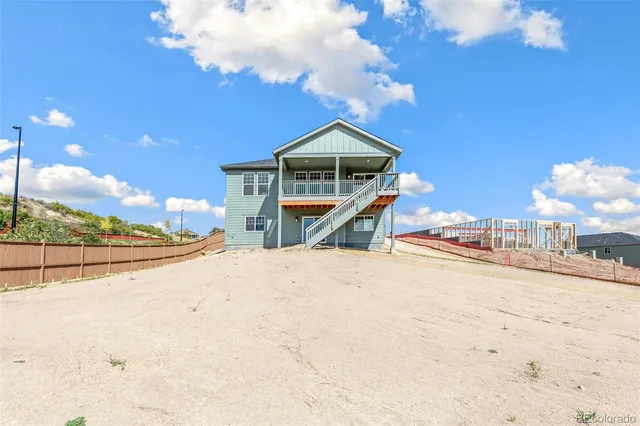 a view of a house with a snow in the yard