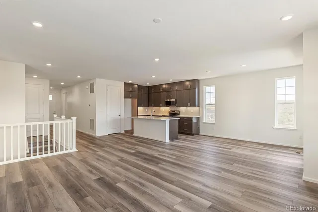 a view of kitchen with wooden floor