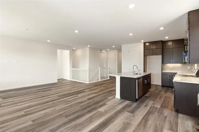 a view of kitchen with wooden floor