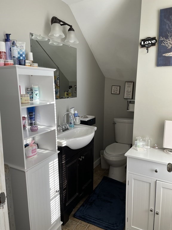 23 Preston Street Springfield, MA 01109 - Photo 13 of 24 a bathroom with a sink toilet and mirror