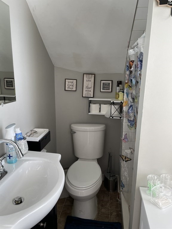 23 Preston Street Springfield, MA 01109 - Photo 14 of 24 a white toilet sitting next to a bathroom sink