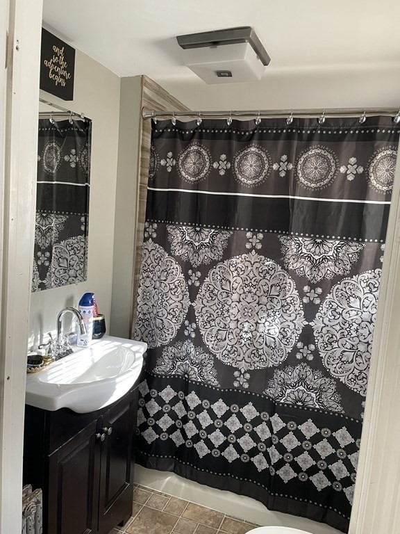23 Preston Street Springfield, MA 01109 - Photo 15 of 24 a bathroom with a sink and a mirror