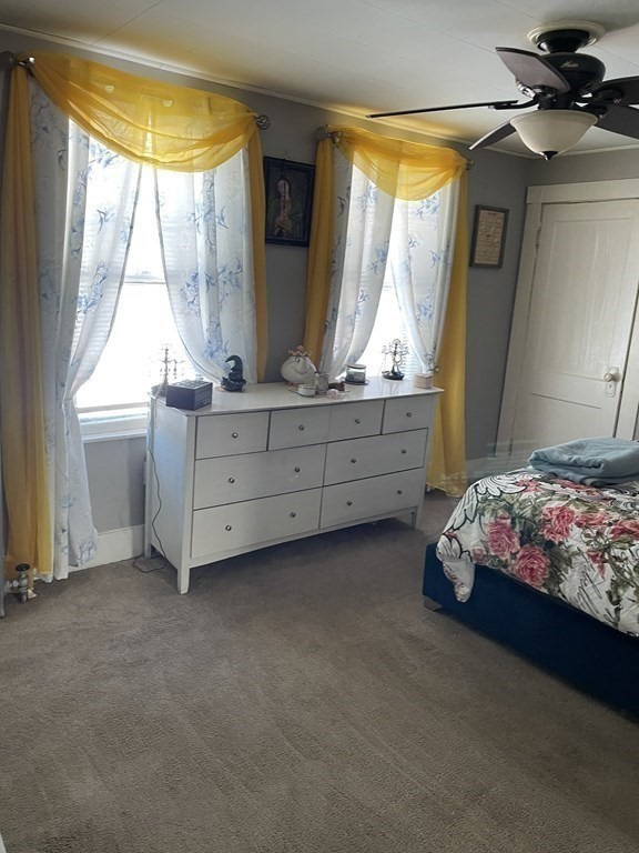 23 Preston Street Springfield, MA 01109 - Photo 16 of 24 a bed room with a bed and a window