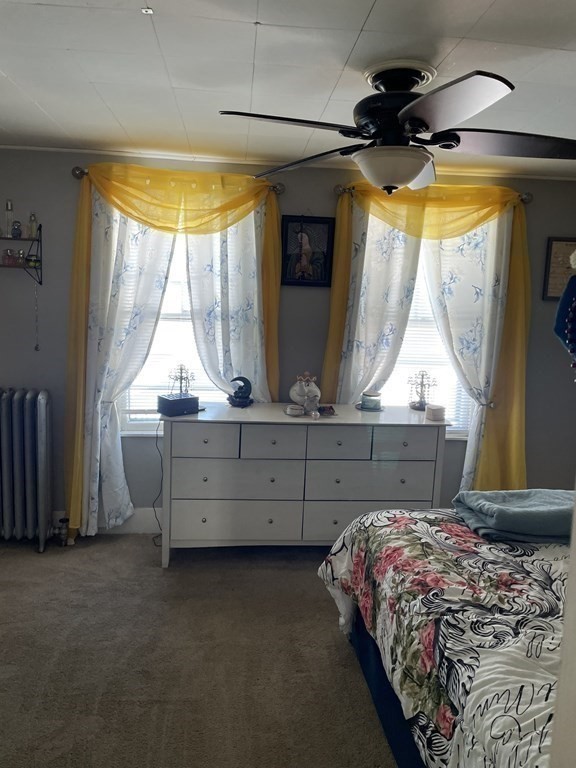 23 Preston Street Springfield, MA 01109 - Photo 17 of 24 a bedroom with a bed and a window