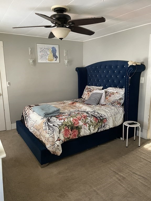23 Preston Street Springfield, MA 01109 - Photo 18 of 24 a bedroom with a bed chair and window