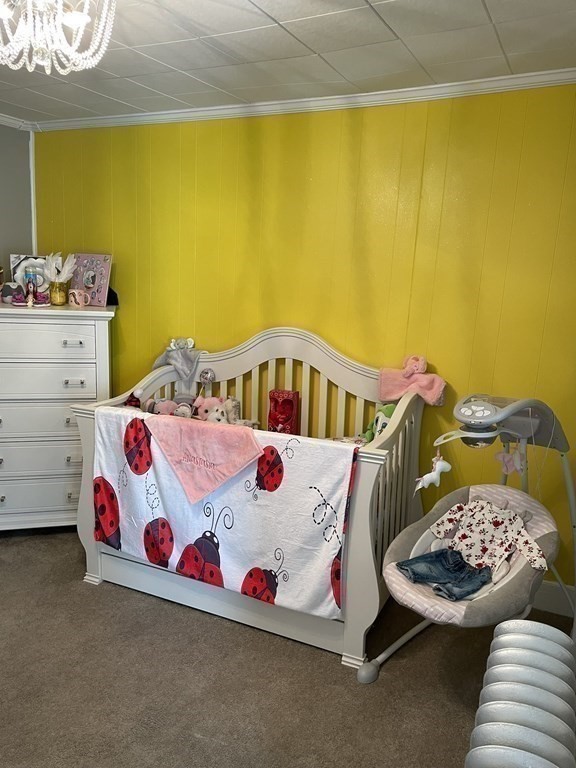 23 Preston Street Springfield, MA 01109 - Photo 20 of 24 a bedroom with a bed and dresser