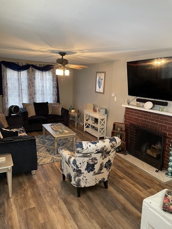 23 Preston Street Springfield, MA 01109 - Photo 4 of 24 a living room with furniture and a flat screen tv