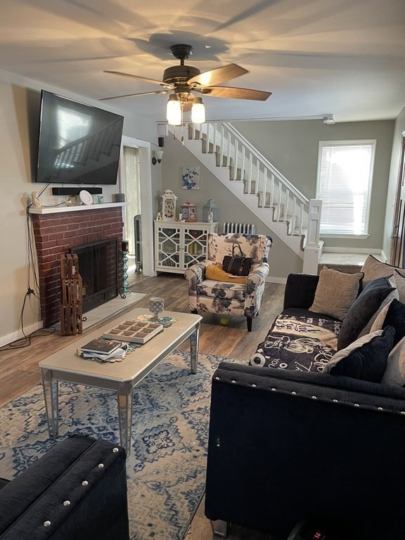 23 Preston Street Springfield, MA 01109 - Photo 5 of 24 a living room with furniture and a flat screen tv