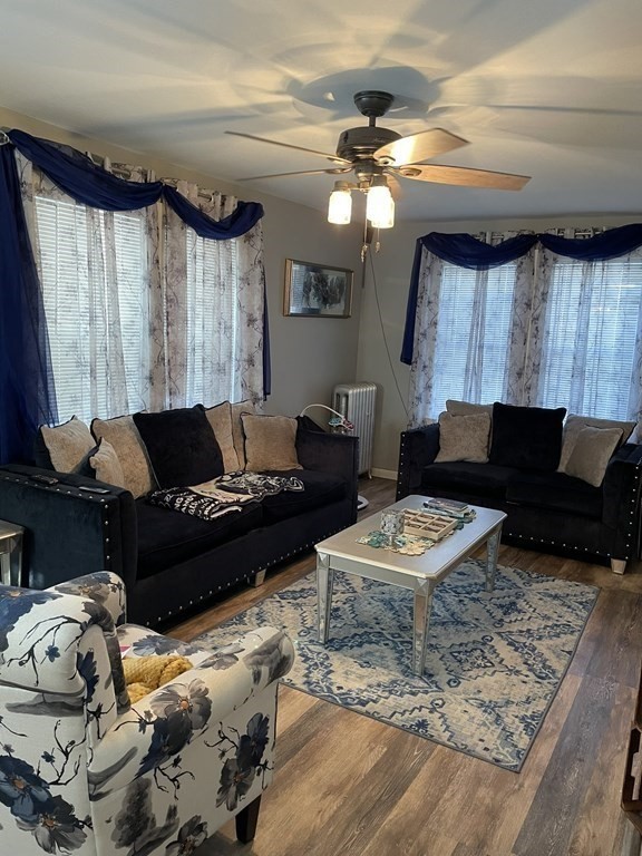 23 Preston Street Springfield, MA 01109 - Photo 7 of 24 a living room with furniture and a flat screen tv
