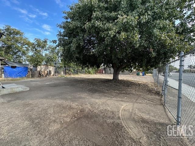 Undisclosed Address Delano, CA 93215 - Photo 15 of 15 a view of road with large trees