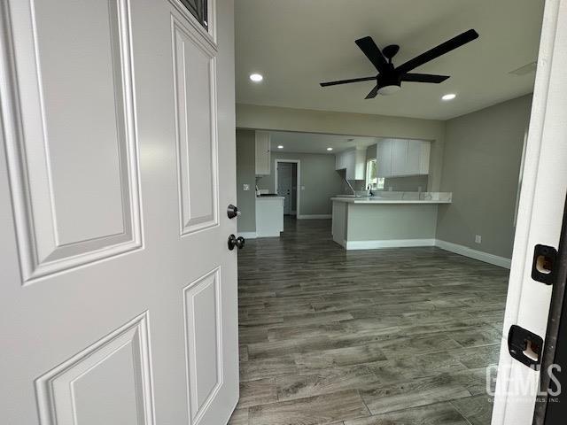 Undisclosed Address Delano, CA 93215 - Photo 2 of 15 a view of a kitchen with wooden floor and a ceiling fan
