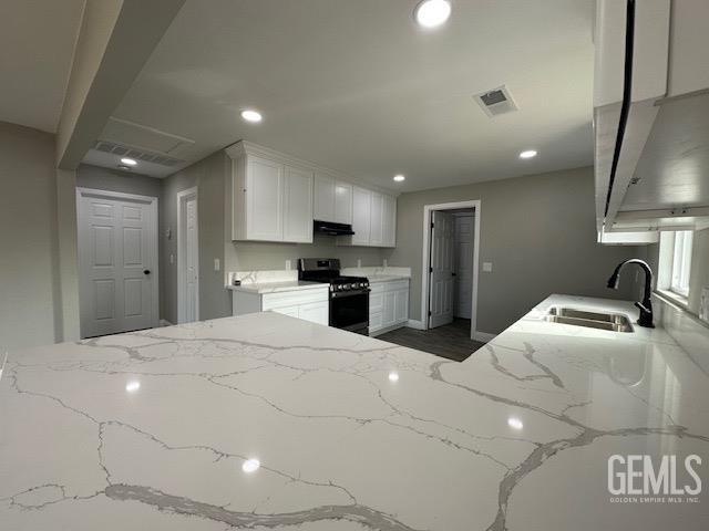 Undisclosed Address Delano, CA 93215 - Photo 7 of 15 a bedroom with a bed and a refrigerator