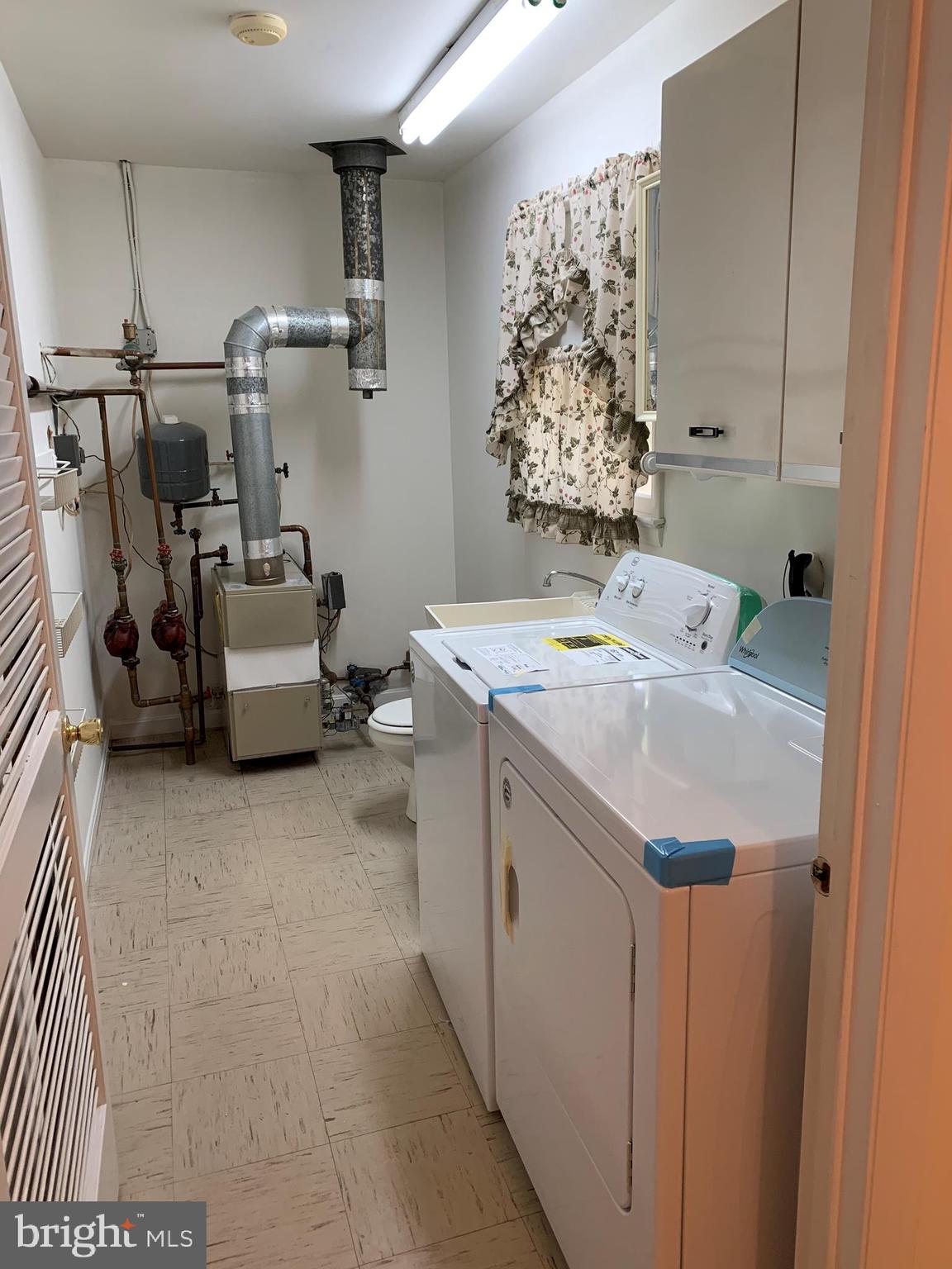 4515 Shirley Gate Road Fairfax, VA 22030 - Photo 15 of 26 a utility room with a sink dryer and washer