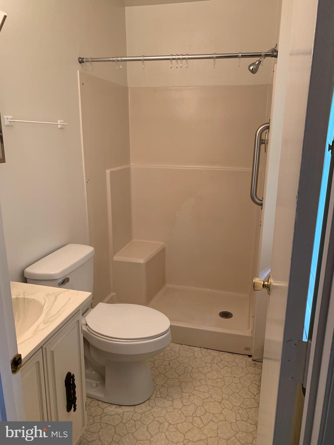 4515 Shirley Gate Road Fairfax, VA 22030 - Photo 24 of 26 a bathroom with a toilet and a shower