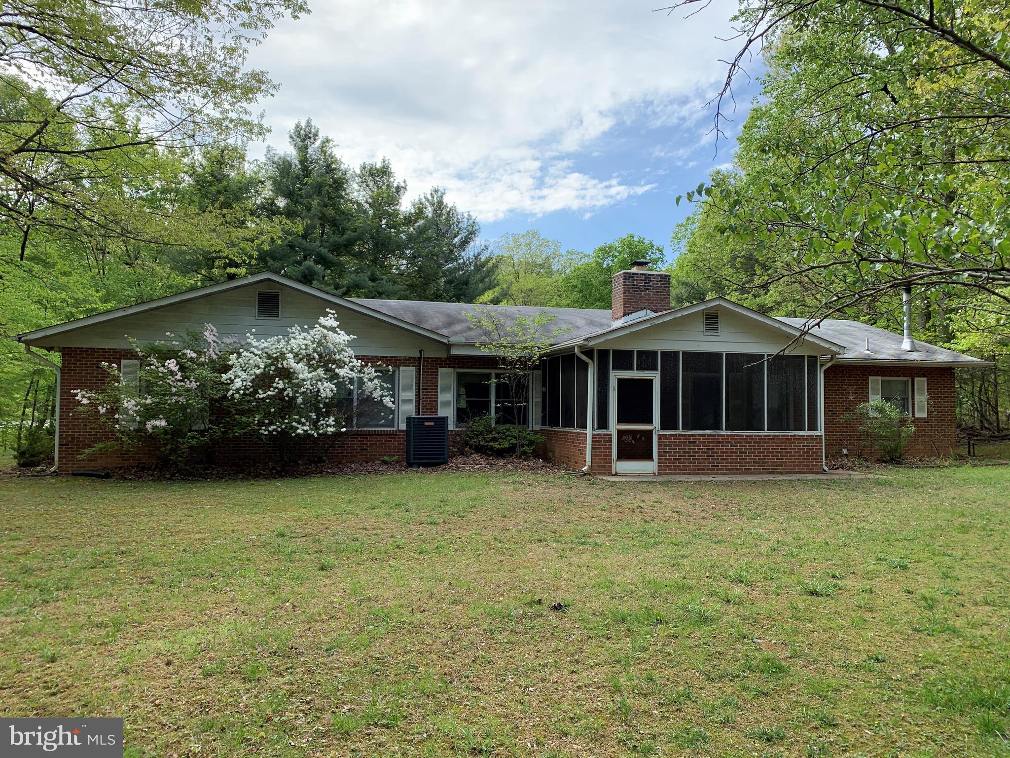4515 Shirley Gate Road Fairfax, VA 22030 - Photo 4 of 26 a front view of a house with a garden