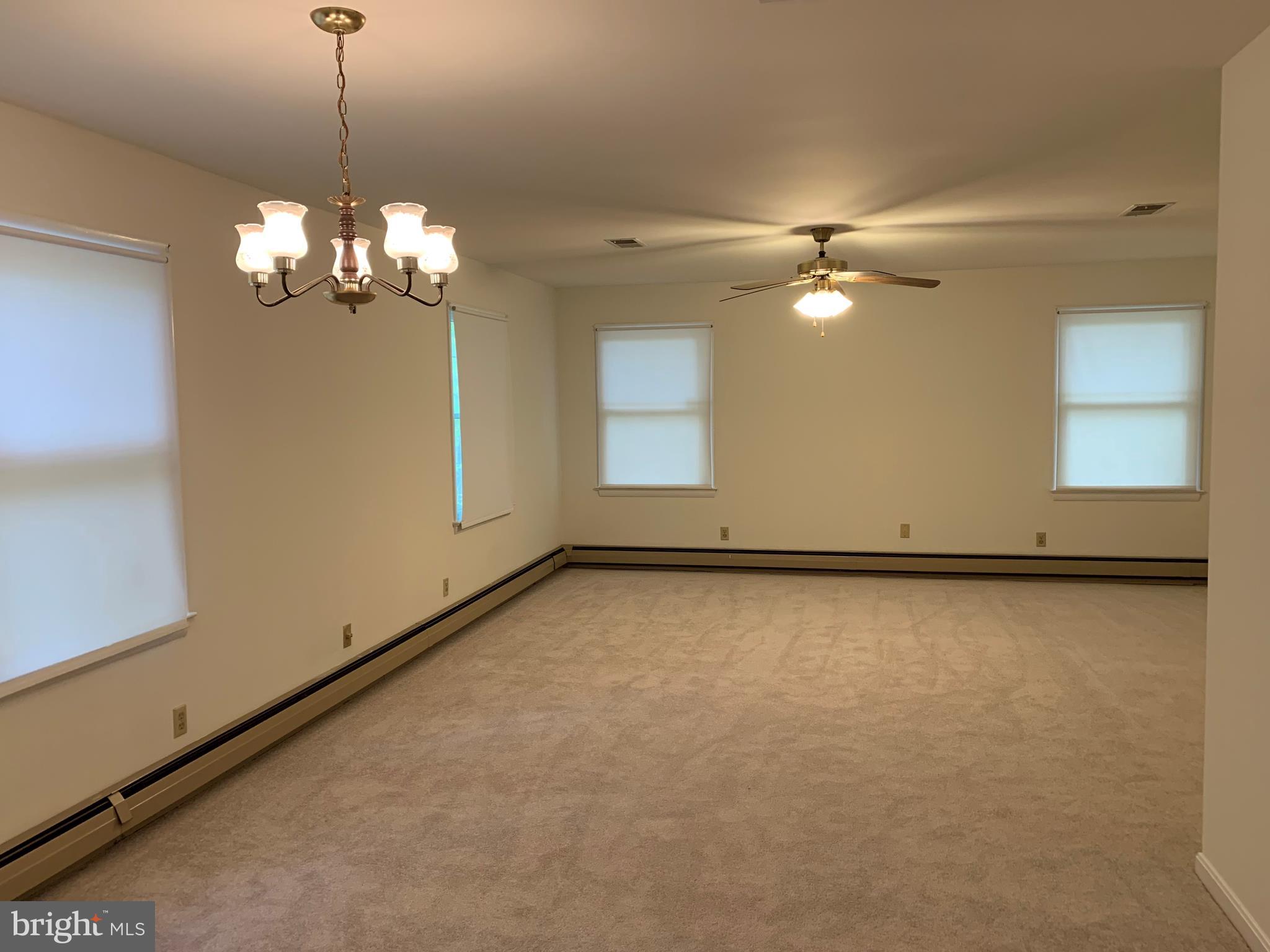 4515 Shirley Gate Road Fairfax, VA 22030 - Photo 8 of 26 a view of a livingroom with a ceiling fan window and a ceiling fan