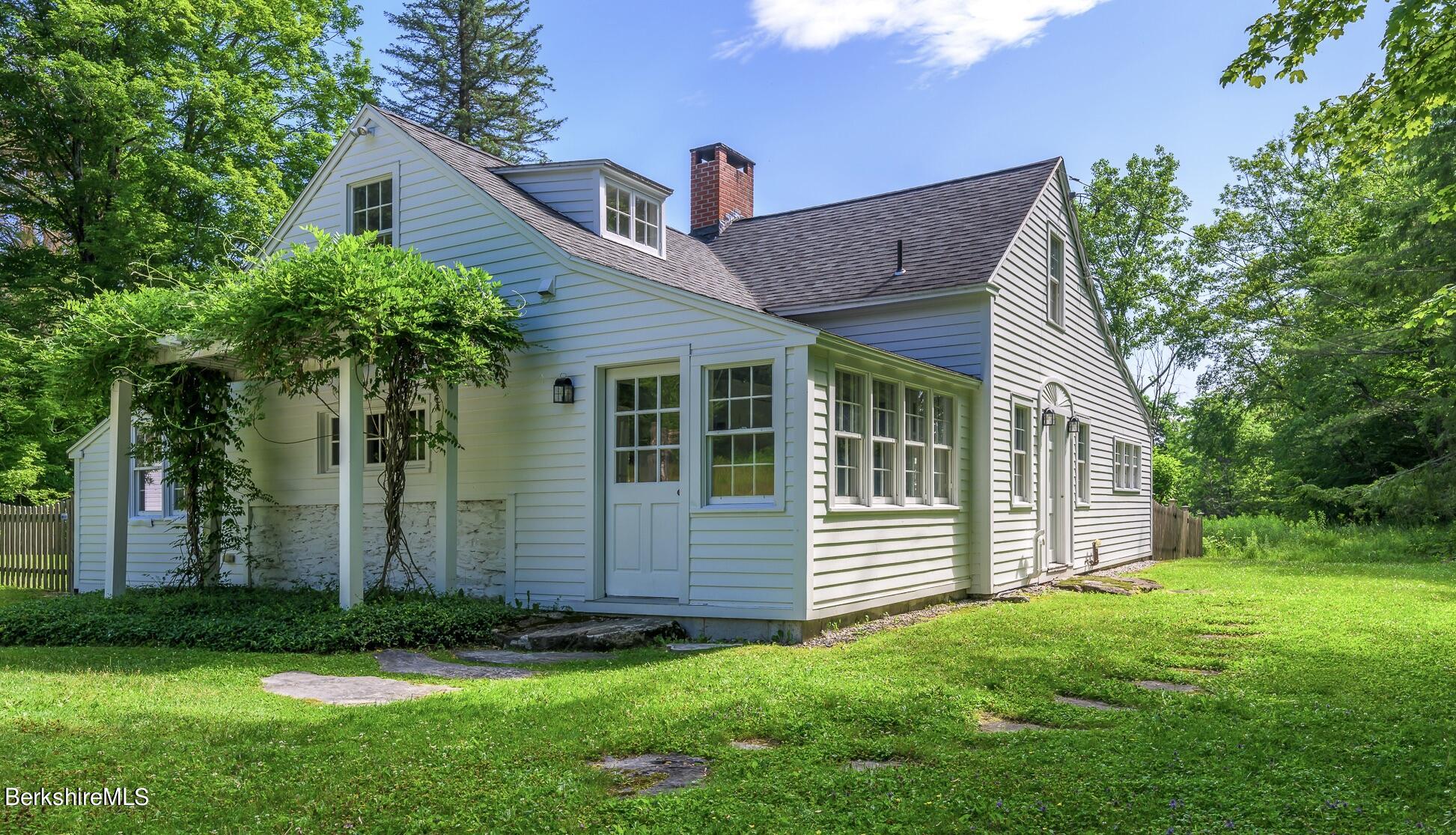 4 Austerlitz Road West Stockbridge, MA 01266 - Photo 1 of 42 a front view of a house with a yard