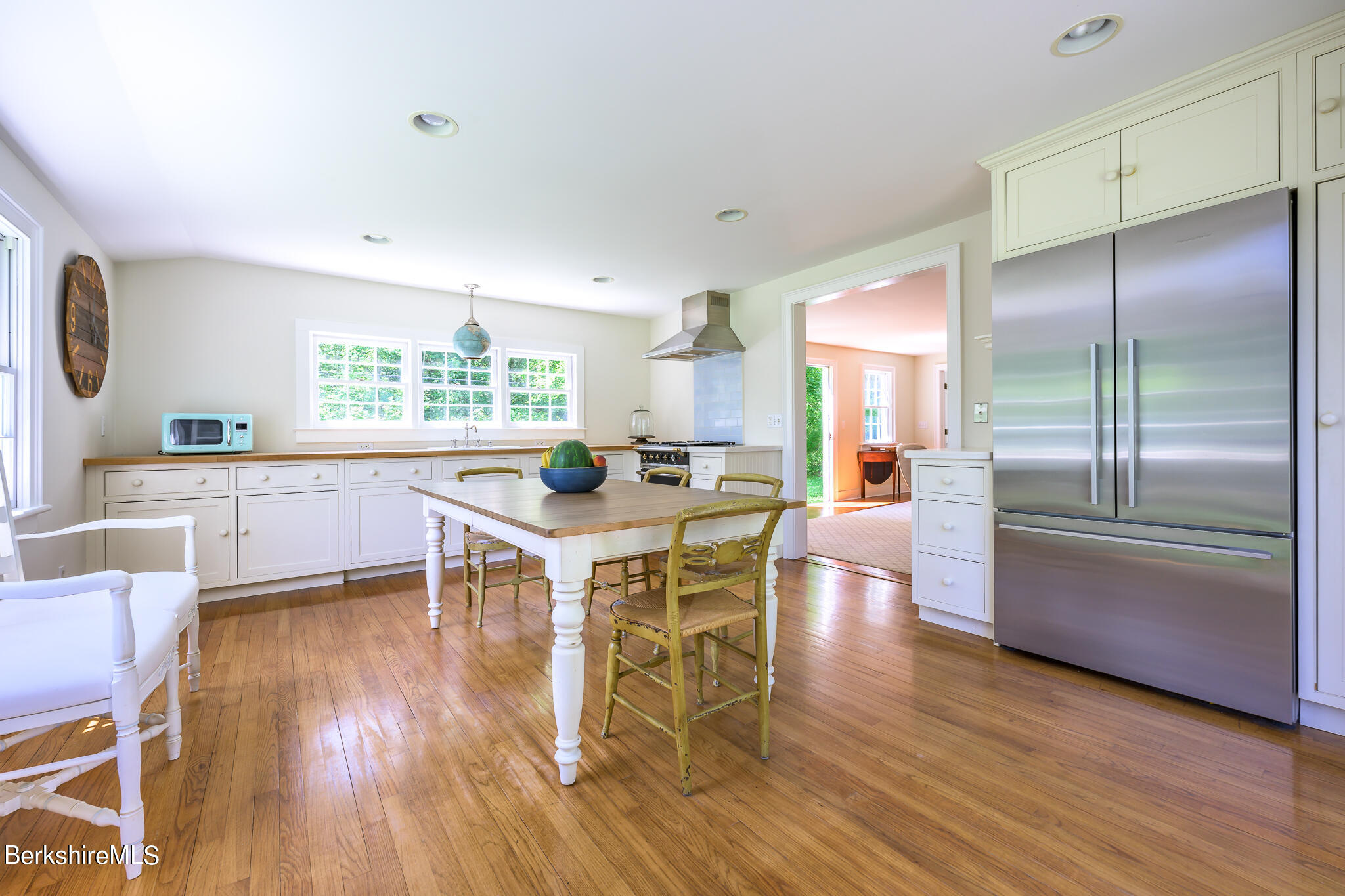 4 Austerlitz Road West Stockbridge, MA 01266 - Photo 14 of 42 a kitchen with stainless steel appliances granite countertop a refrigerator a stove a sink dishwasher and a dining table with wooden floor