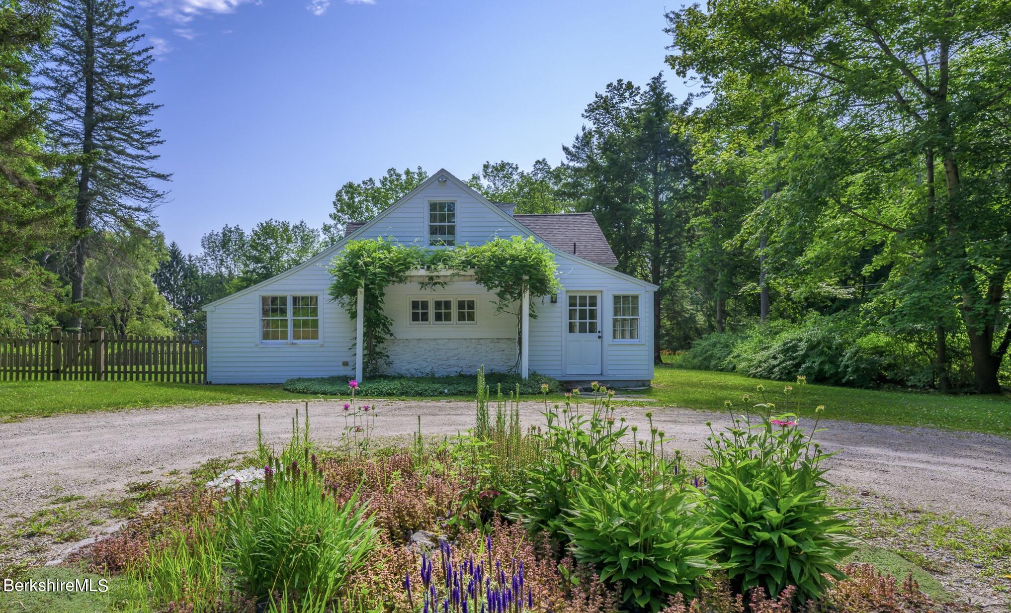 4 Austerlitz Road West Stockbridge, MA 01266 - Photo 2 of 42 a front view of a house with a yard
