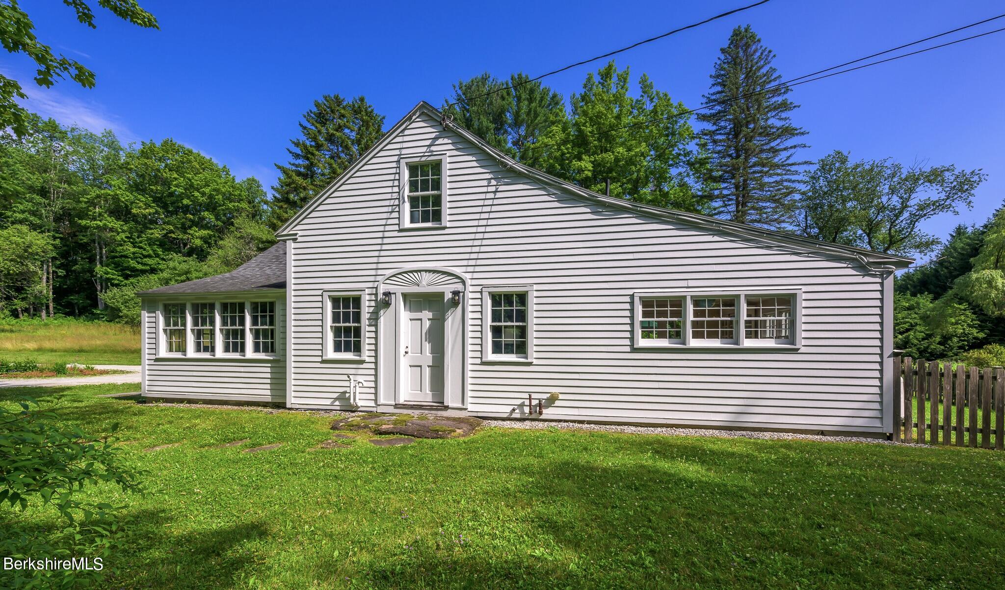 4 Austerlitz Road West Stockbridge, MA 01266 - Photo 4 of 42 a front view of a house with a yard