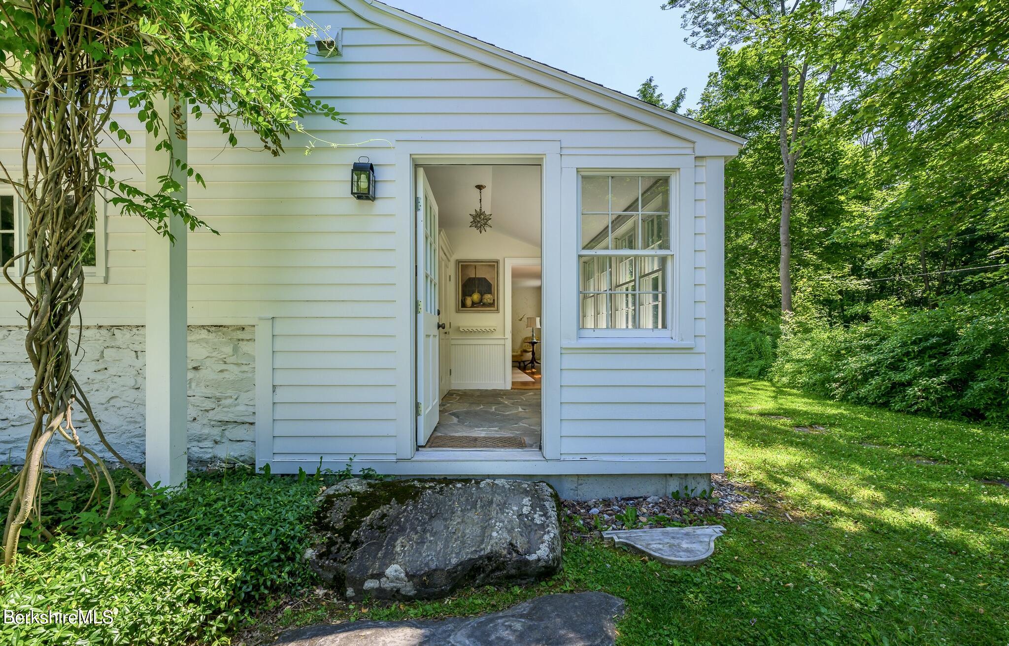4 Austerlitz Road West Stockbridge, MA 01266 - Photo 8 of 42 a front view of a house with a yard