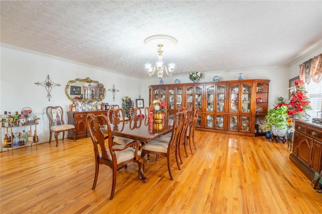 2440 Deadwyler Road Maysville, GA 30558 - Photo 12 of 79 a dining room with furniture entryway and wooden floor