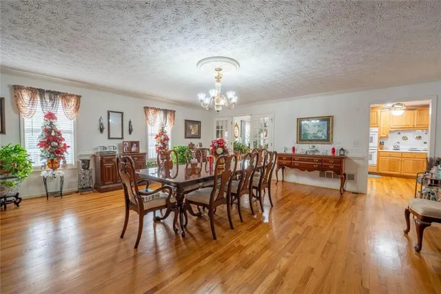 a work room with furniture and a floor to ceiling window