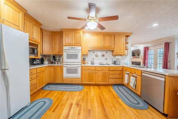 a dining room with furniture window and wooden floor
