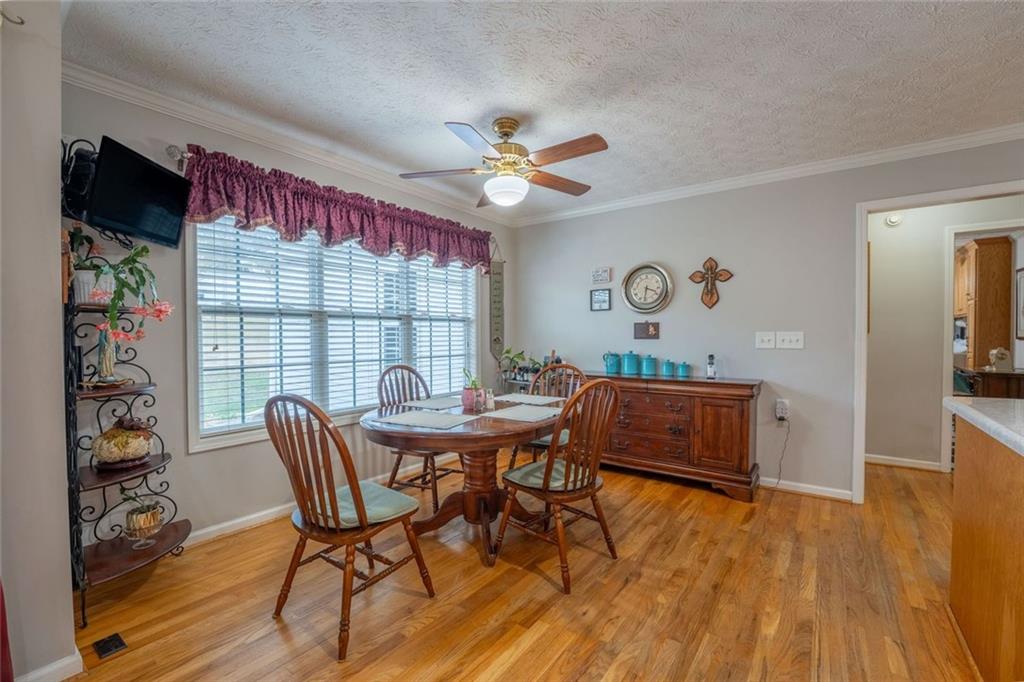 2440 Deadwyler Road Maysville, GA 30558 - Photo 16 of 79 a work room with furniture and a floor to ceiling window
