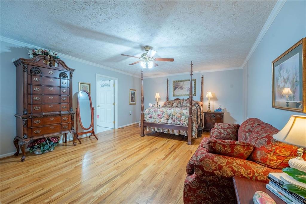 2440 Deadwyler Road Maysville, GA 30558 - Photo 18 of 79 a bed room with a bed and a chair