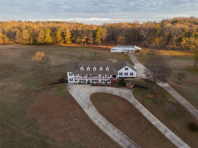 a front view of a building with a garden
