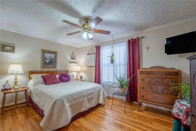 a bed room with a bed and a chandelier