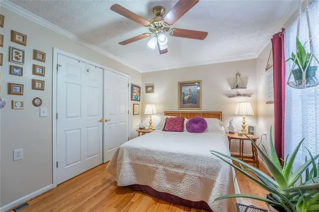 a bed room with a bed and a chandelier