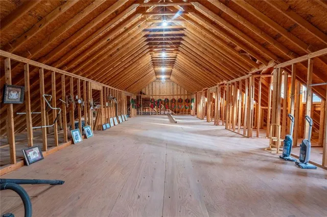 a view of a livingroom with furniture and an empty room