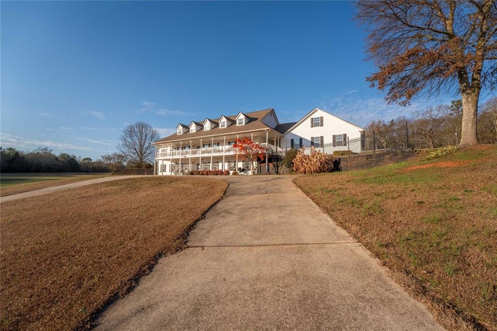 2440 Deadwyler Road Maysville, GA 30558 - Photo 57 of 79 a view of house with a yard and a large parking space