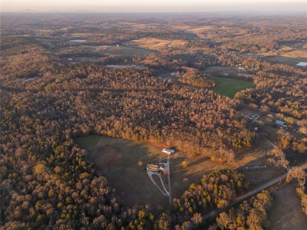 2440 Deadwyler Road Maysville, GA 30558 - Photo 68 of 79 an aerial view of house with yard and mountain view in back