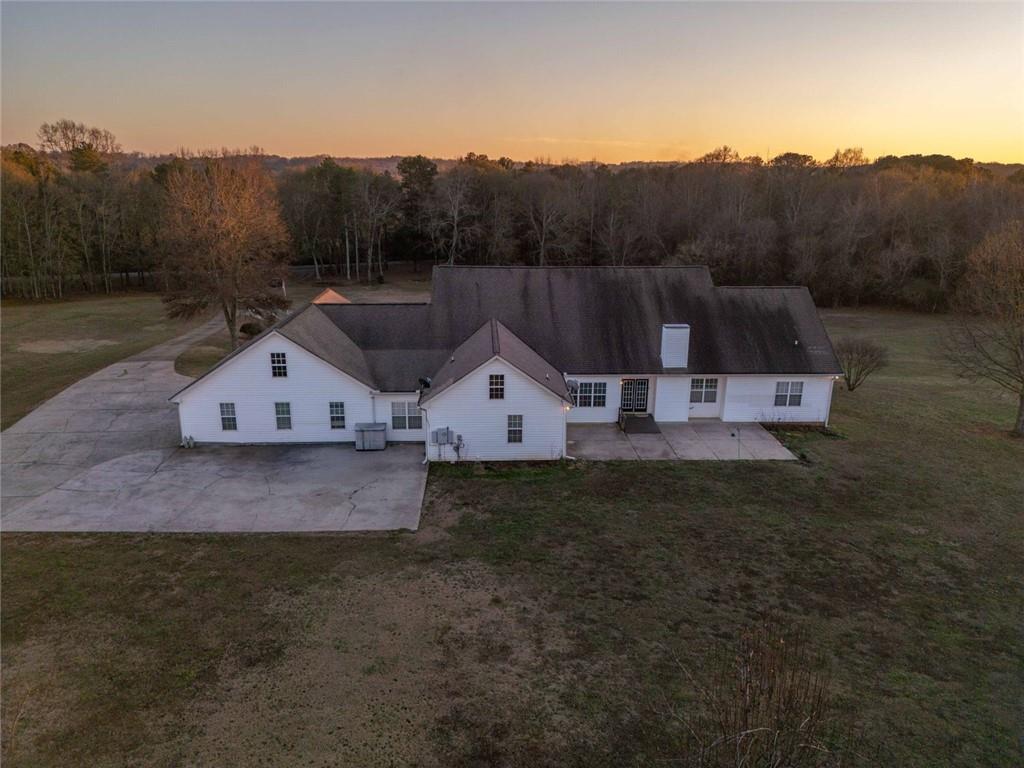 2440 Deadwyler Road Maysville, GA 30558 - Photo 75 of 79 a view of a large house with a big yard and large tree