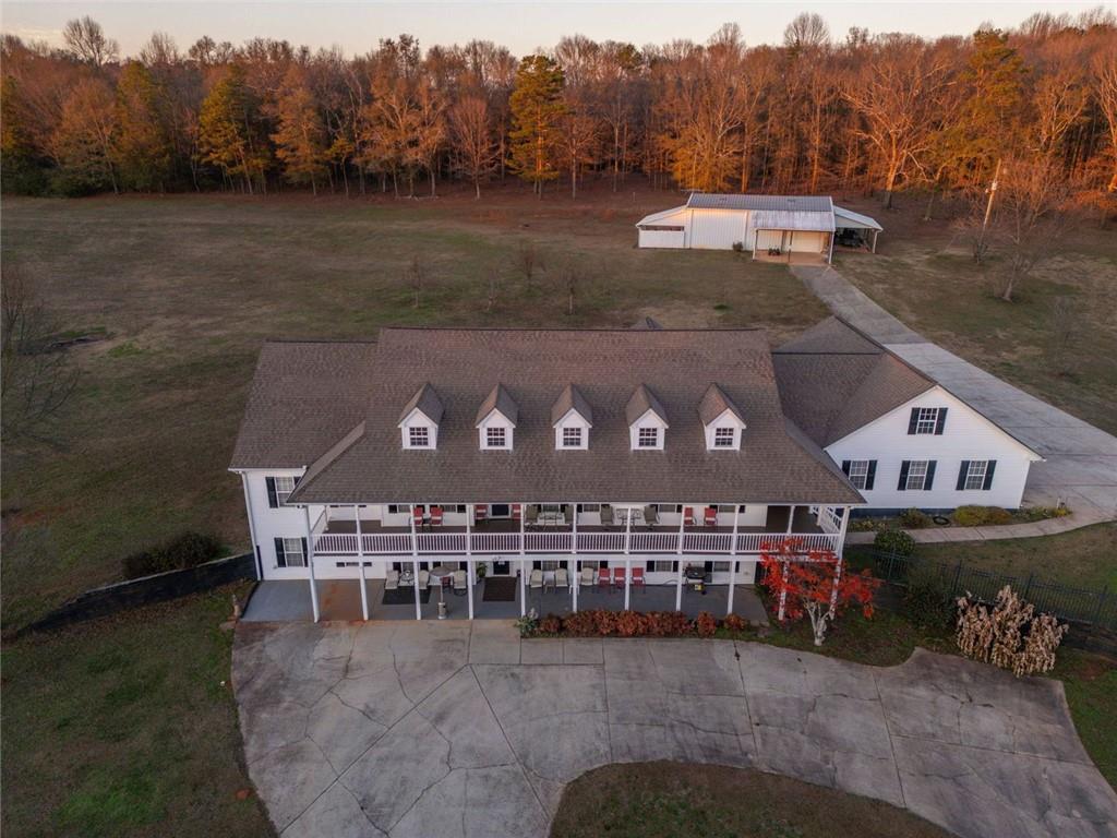 2440 Deadwyler Road Maysville, GA 30558 - Photo 76 of 79 a view of a house with a yard next to a lake