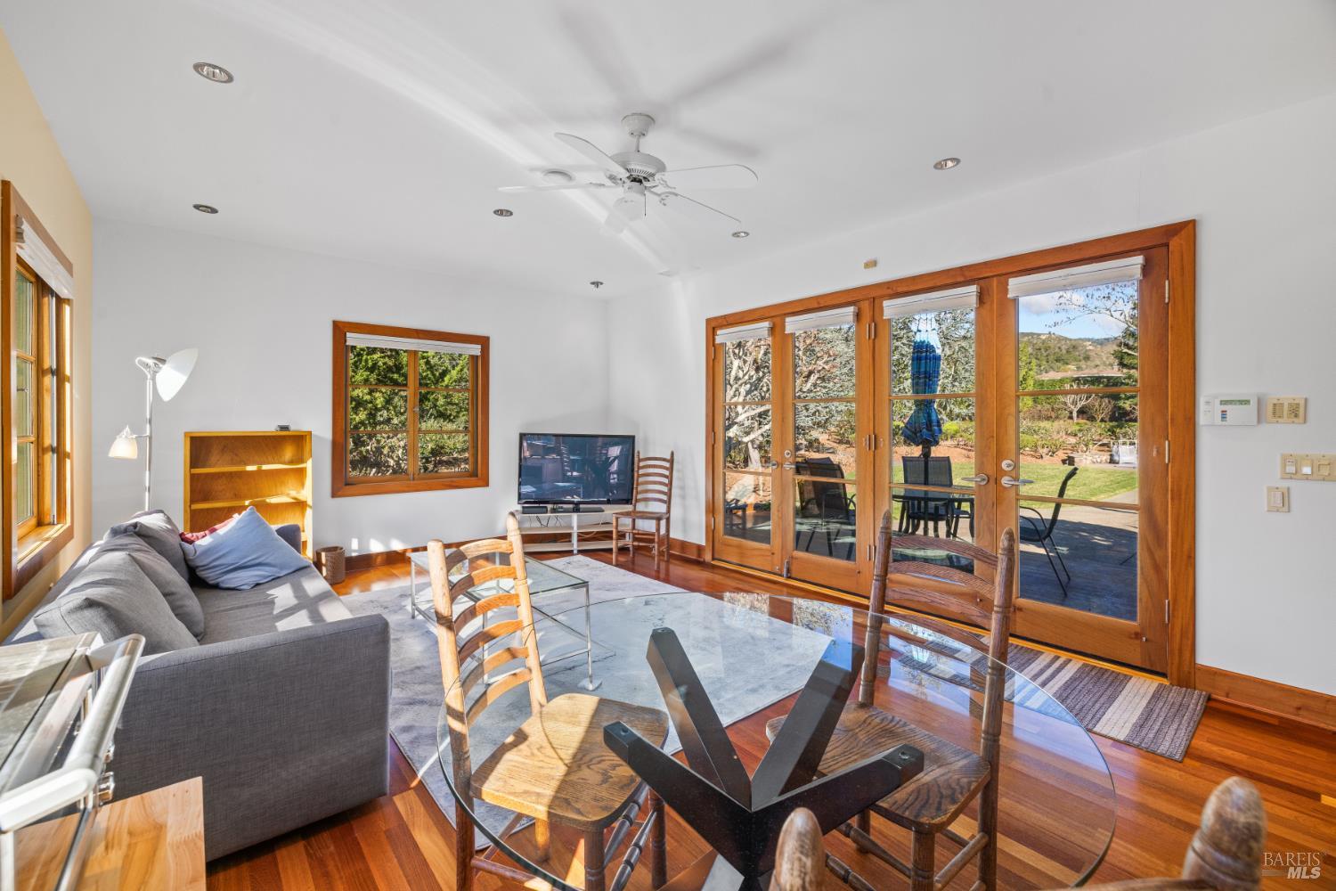 1545 North Castle Road Sonoma, CA 95476 - Photo 14 of 19 a living room with furniture and a floor to ceiling window