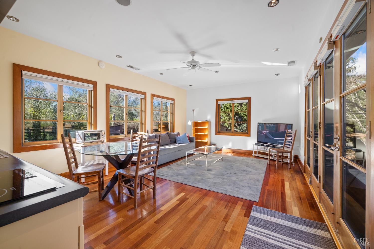1545 North Castle Road Sonoma, CA 95476 - Photo 5 of 19 a living room with furniture a large window and wooden floor