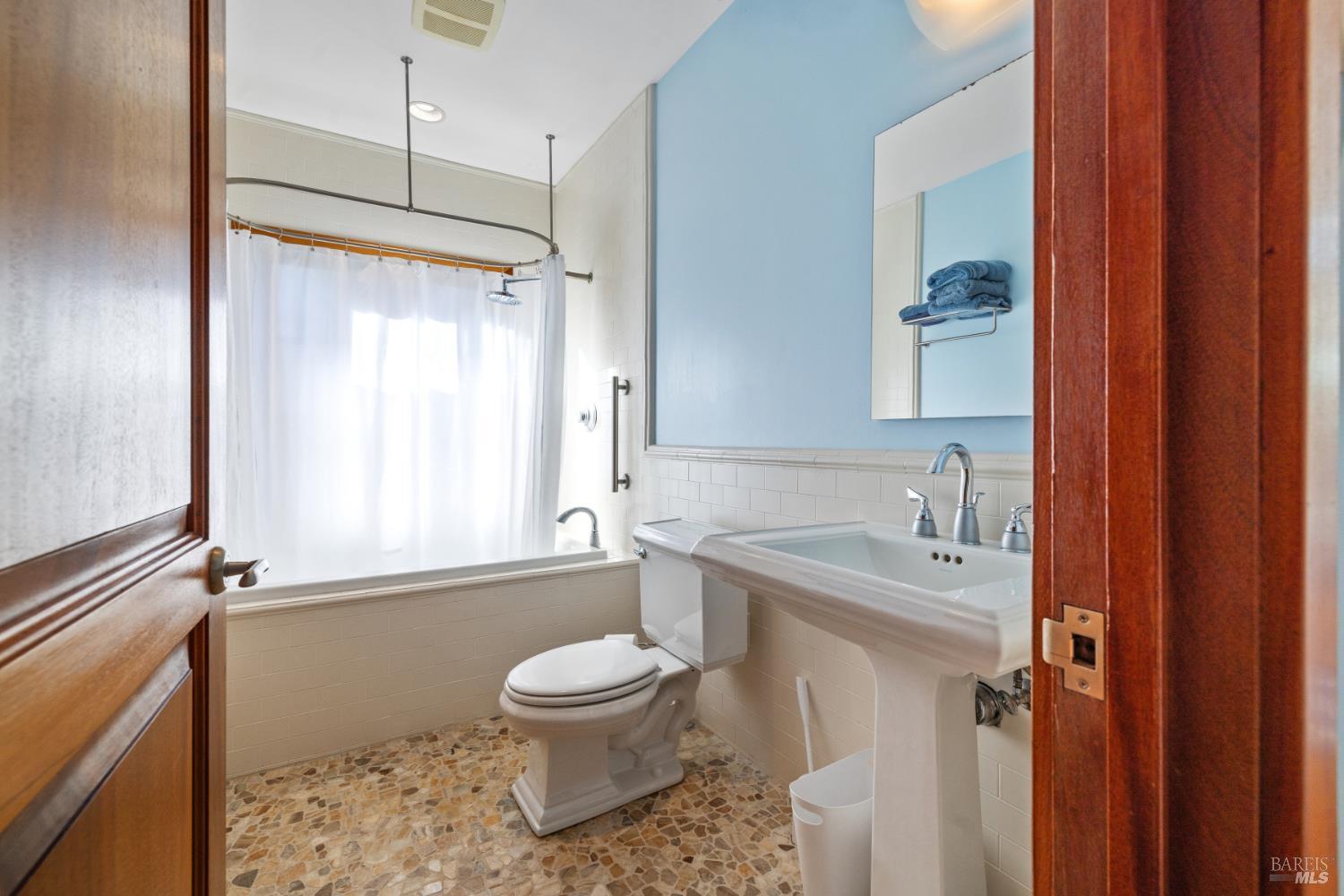 1545 North Castle Road Sonoma, CA 95476 - Photo 9 of 19 a bathroom with a sink a toilet and shower