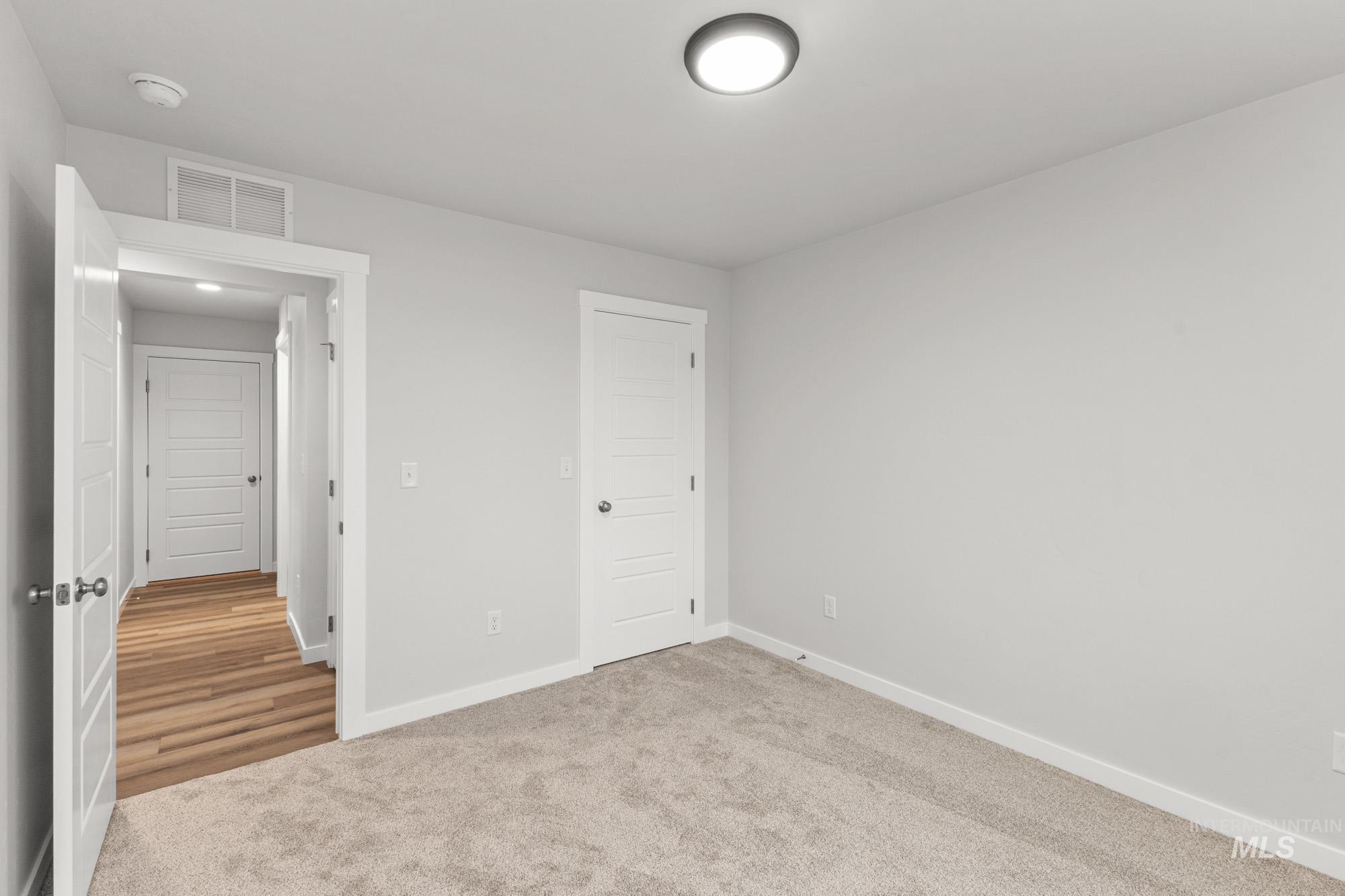 3762 West Maypearl Street Meridian, ID 83642 - Photo 10 of 29 Unfurnished bedroom with carpet floors and baseboards