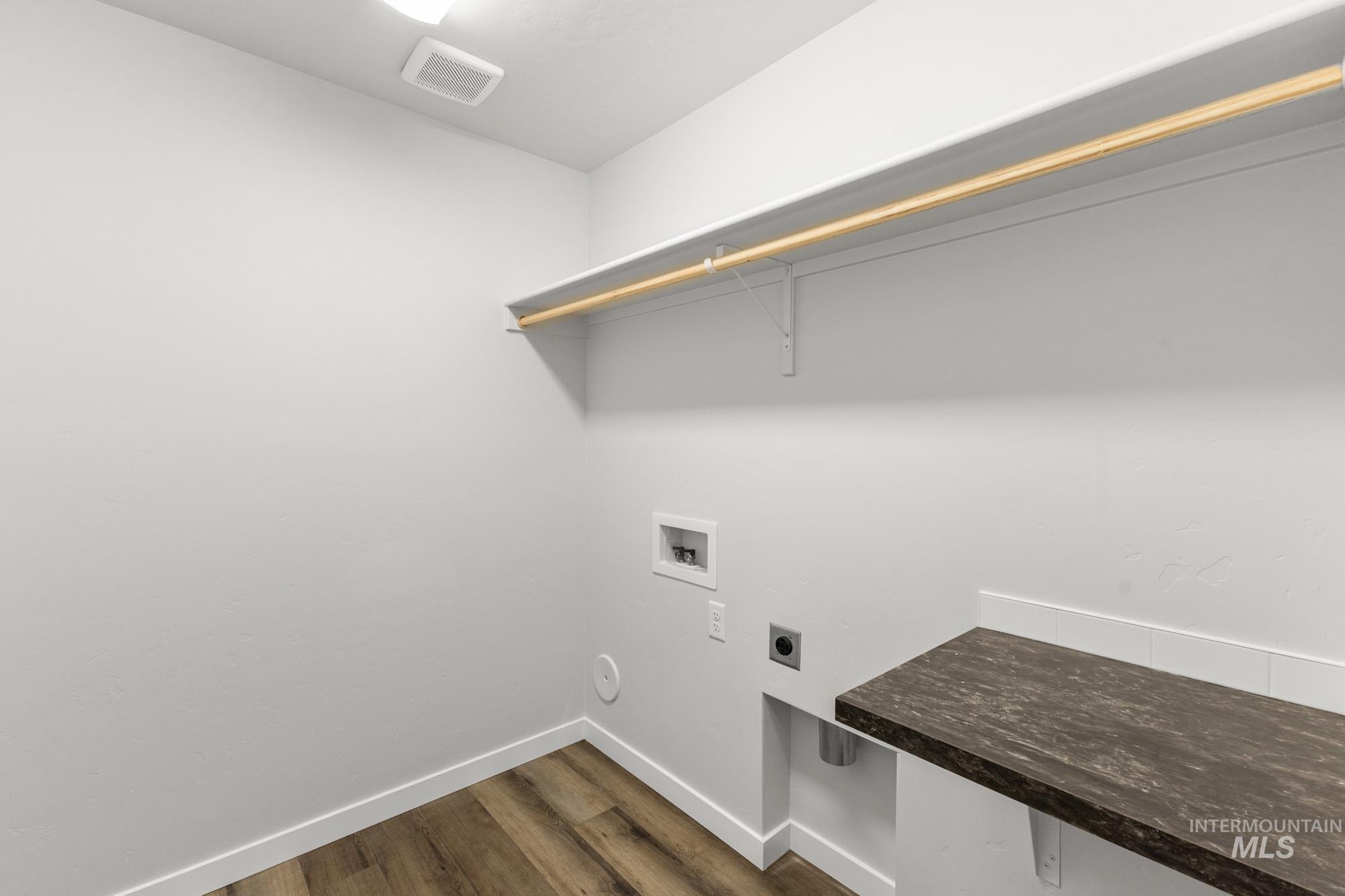 3762 West Maypearl Street Meridian, ID 83642 - Photo 12 of 29 Washroom featuring dark wood-style flooring, hookup for an electric dryer, and hookup for a washing machine
