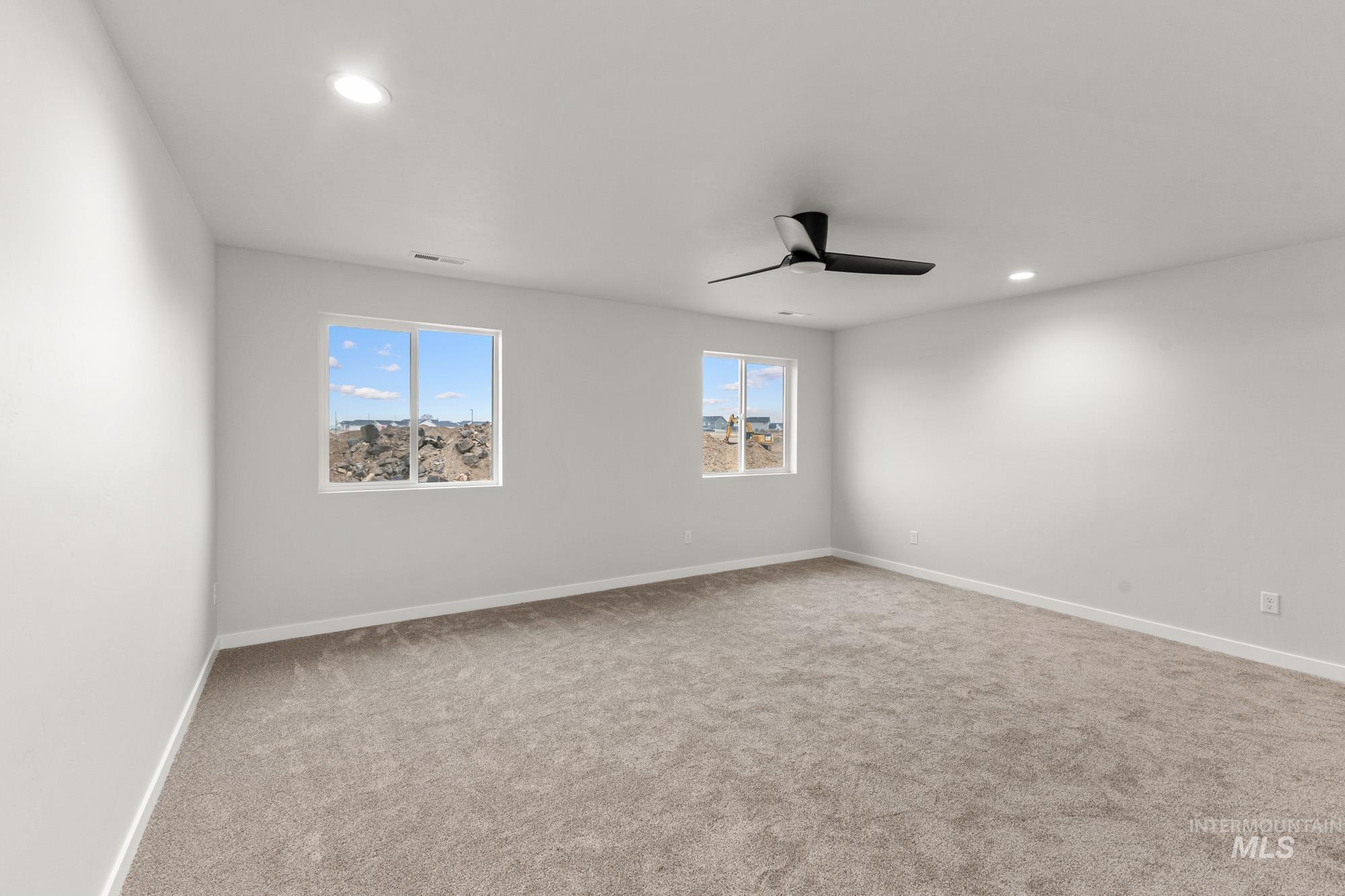 3762 West Maypearl Street Meridian, ID 83642 - Photo 22 of 29 Empty room with recessed lighting and light carpet